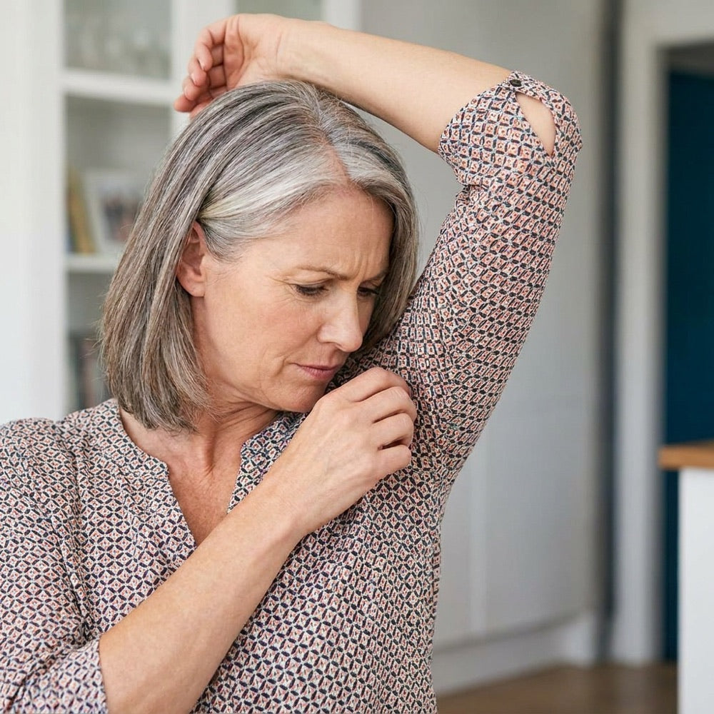 Woman checking for body odor
